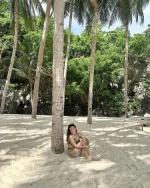find me under the palms 🌴🥥🌺.webp